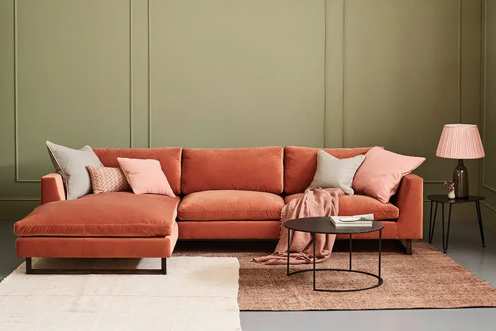 comfortable pink sofa in a classic home