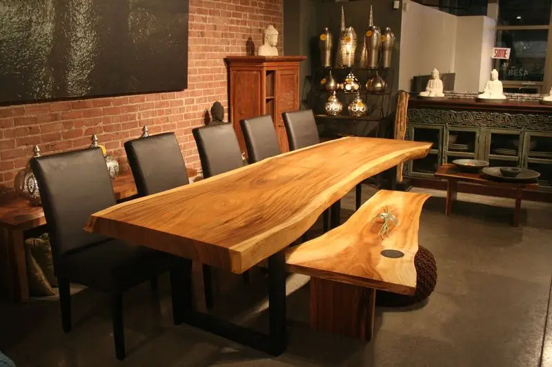 freeform dining table in suar wood with metal legs