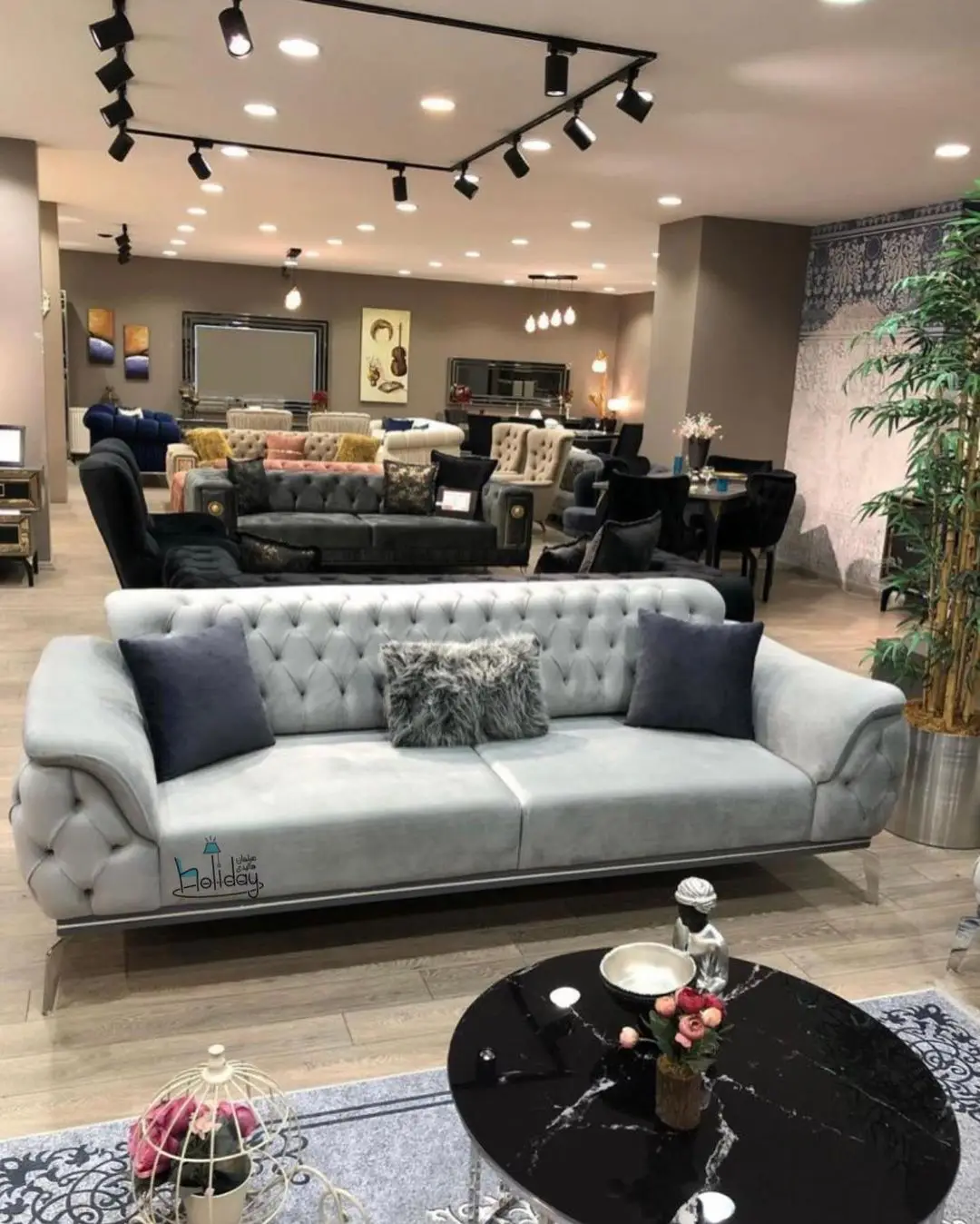 An example Patrice model of the holiday sofa in black and gray color Luxury design